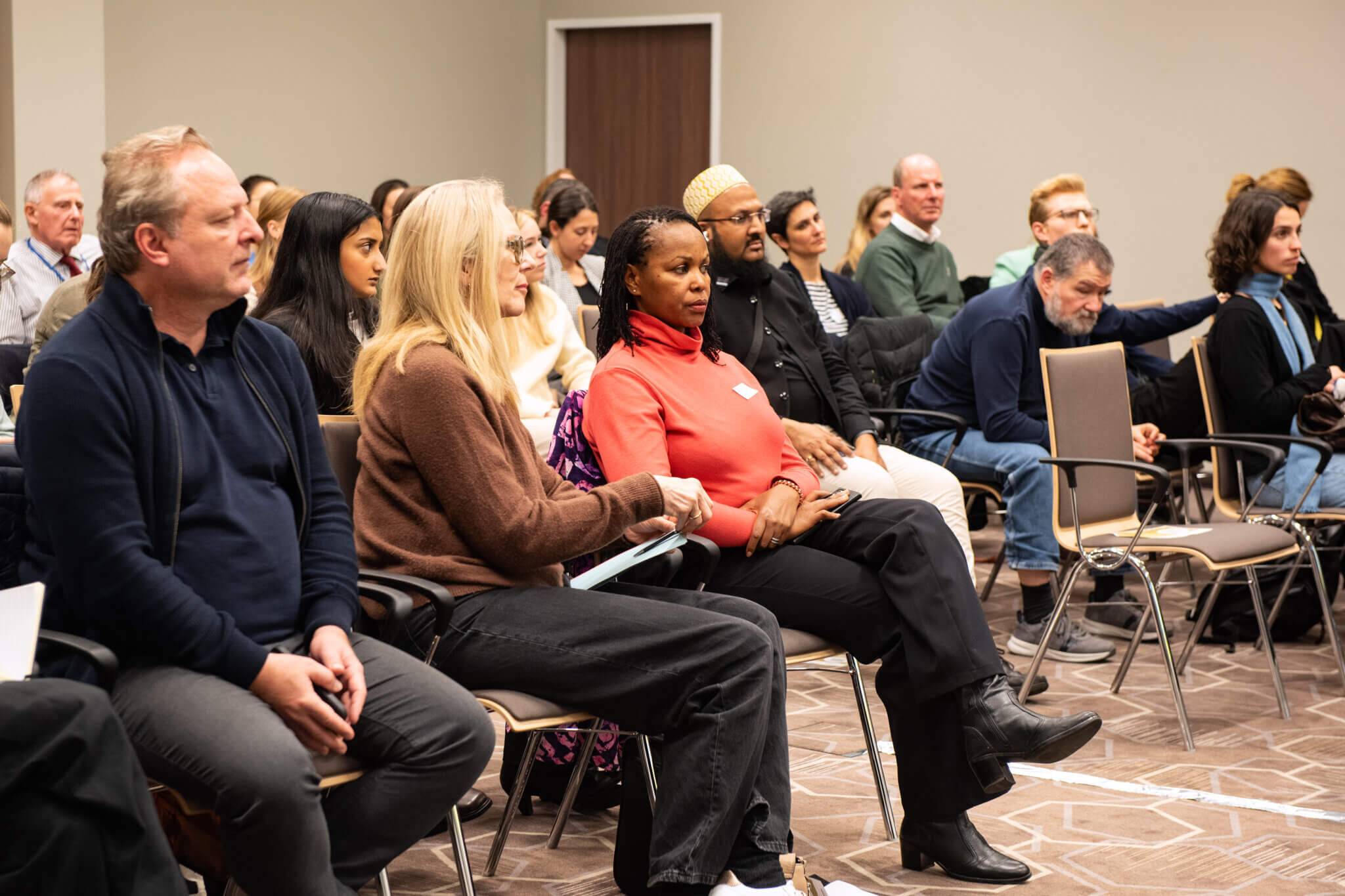 On the picture you can see a mixed group of people sitting on chairs and listening. They are taking part in a panel discussion on inclusive humanitarian action in Vienna.