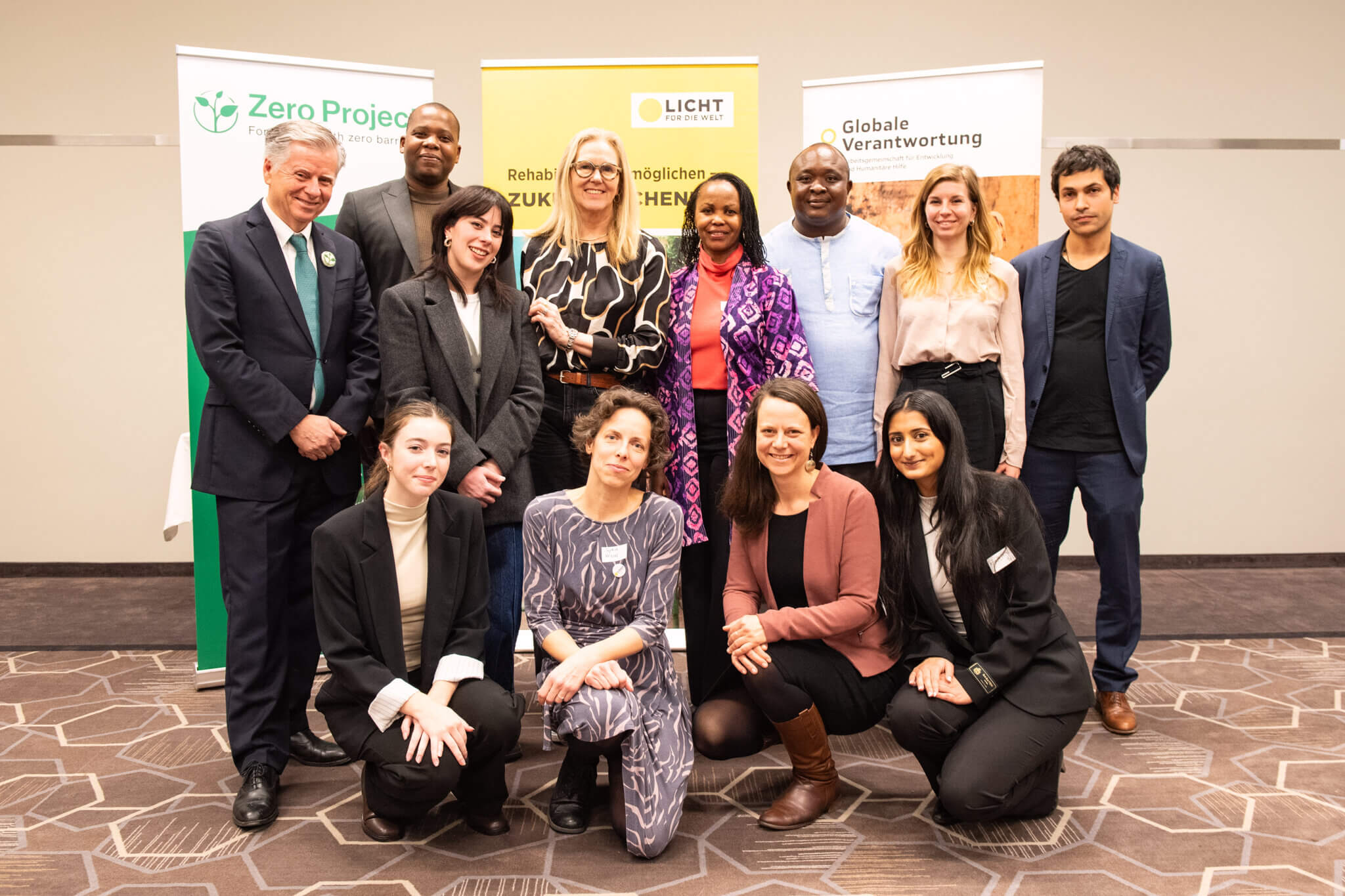 On the picture you can see a group of twelve people, 8 women and 4 men. They are taking part in a panel discussion around inclusive humanitarian action in Vienna which was organized by the NGO Light for the World.
