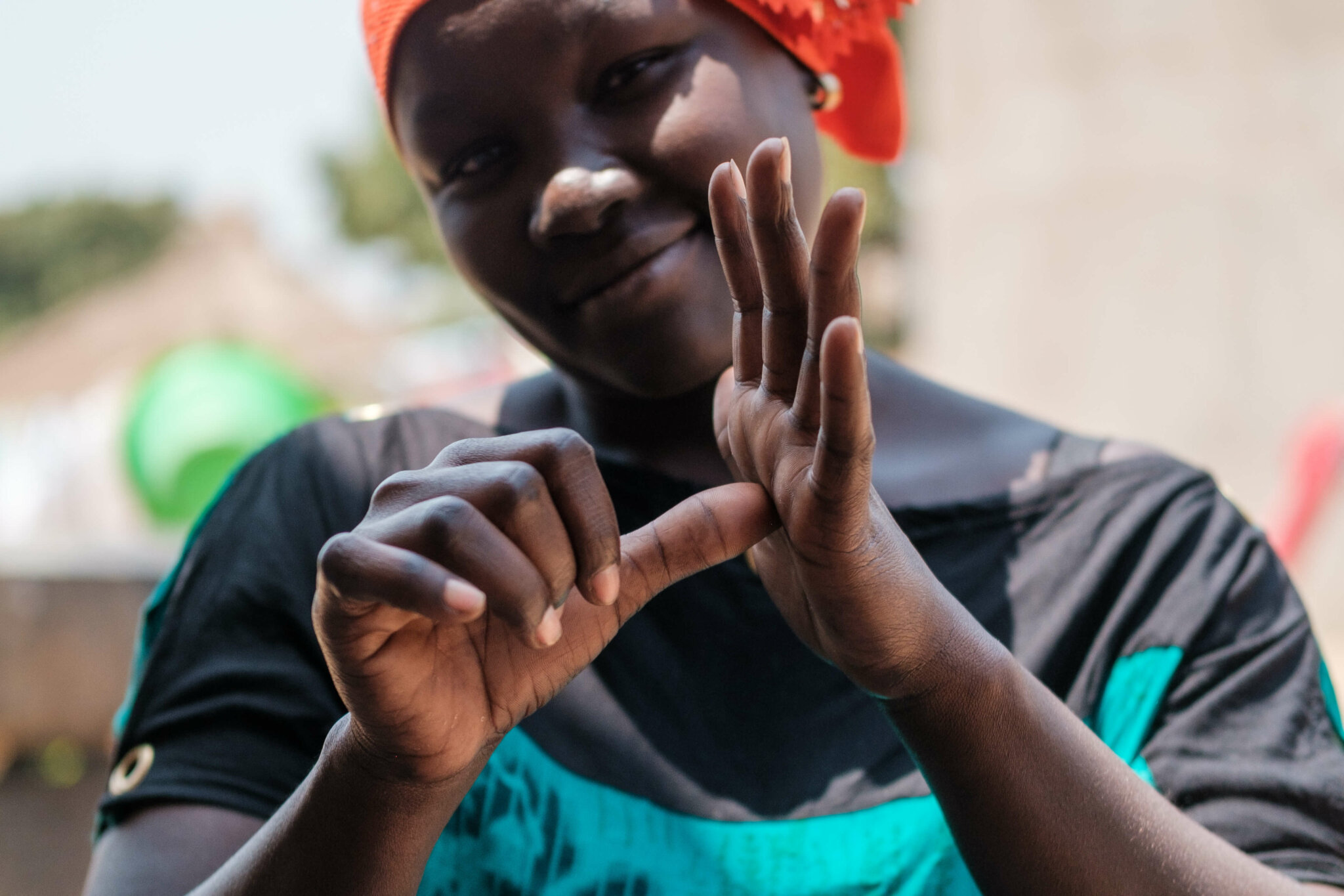 A project participant signs the word 