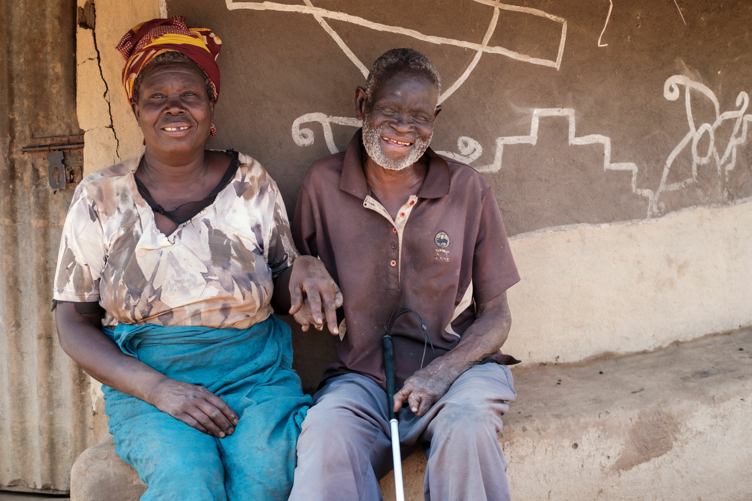 Image of a woman and man holding hands. They are participants in the project: Overcoming Barriers to Food Security: A photo narrative by people with disabilities.