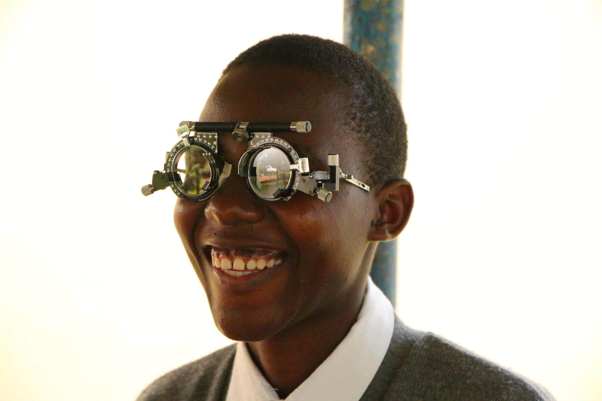 Image of Aidah, a pupil at Iganga Secondary School in Uganda, having her eyes tested as part of the child eye health 1, 2, 3 I can see! programme. ©Light for the World.