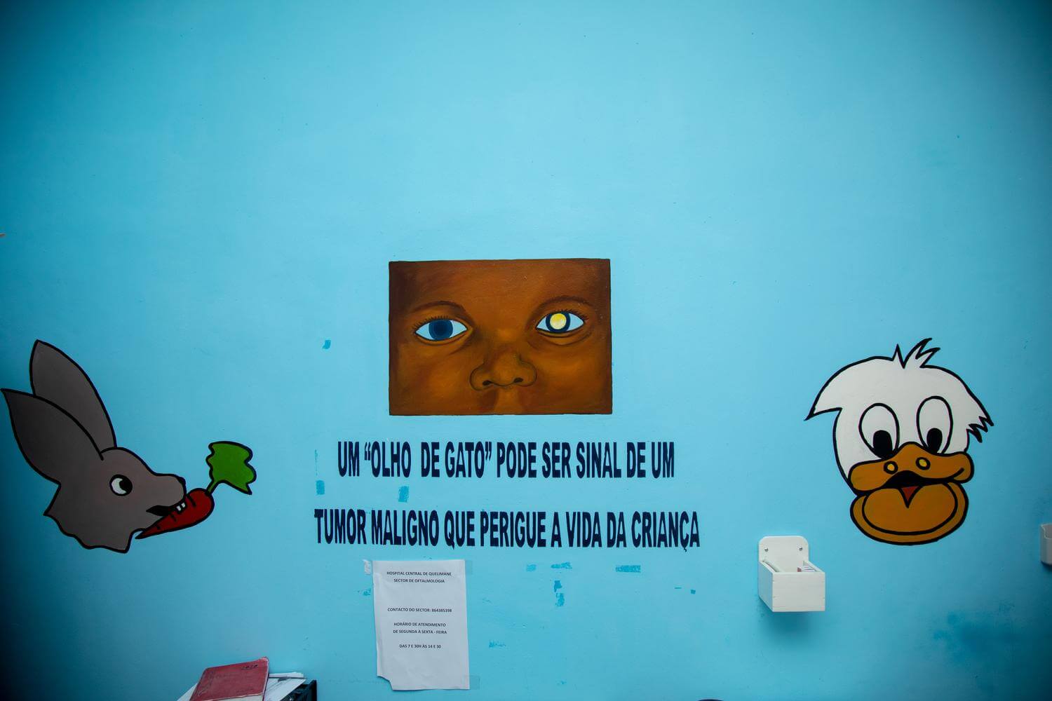 Image of a cartoon on a wall at the eye clinic at Quelimane Central Hospital to raise awareness of child eye health in Mozambique. This one advises 