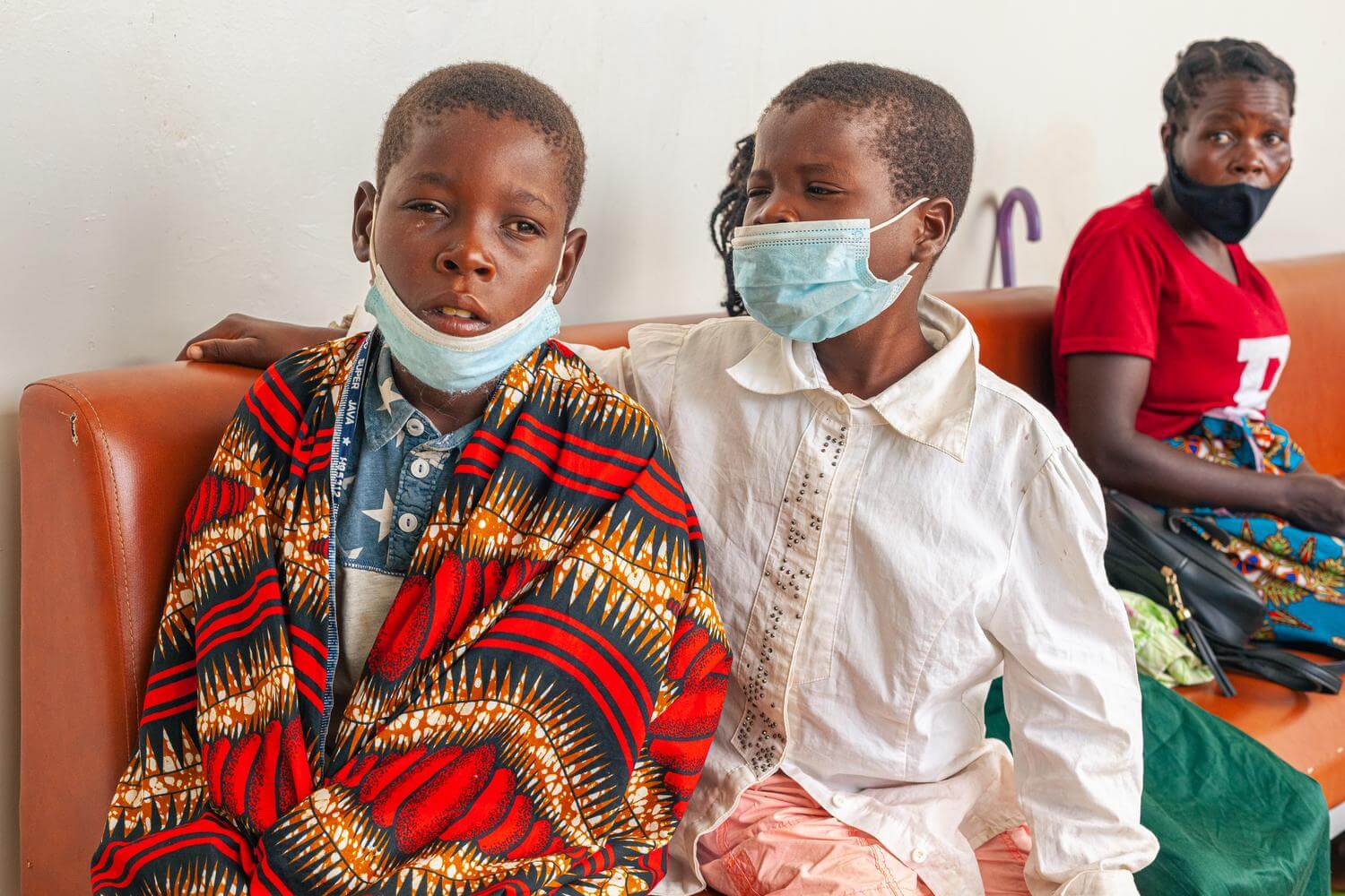 Image of two brothers who received cataract surgery at the eye clinic in Quelimane, Mozambique.