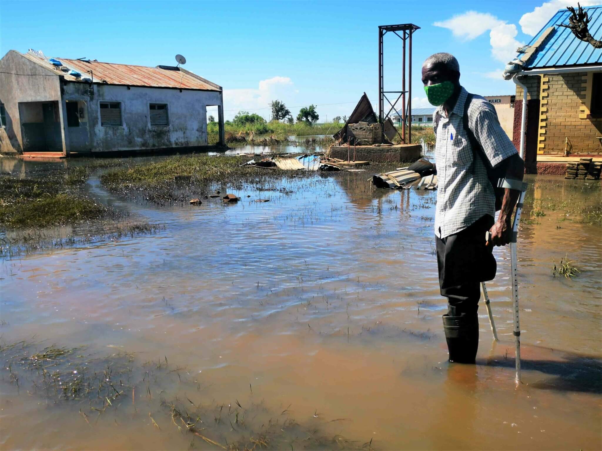 Luis Faquira, the Sofala district representative of FAMOD stands in flooded water in the aftermath of Cyclone Idai.