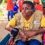 A Disability Inclusion Advisor from Light for the World in Mozambique being interviewed by a local TV station. The DIF is a woman who uses a wheelchair.